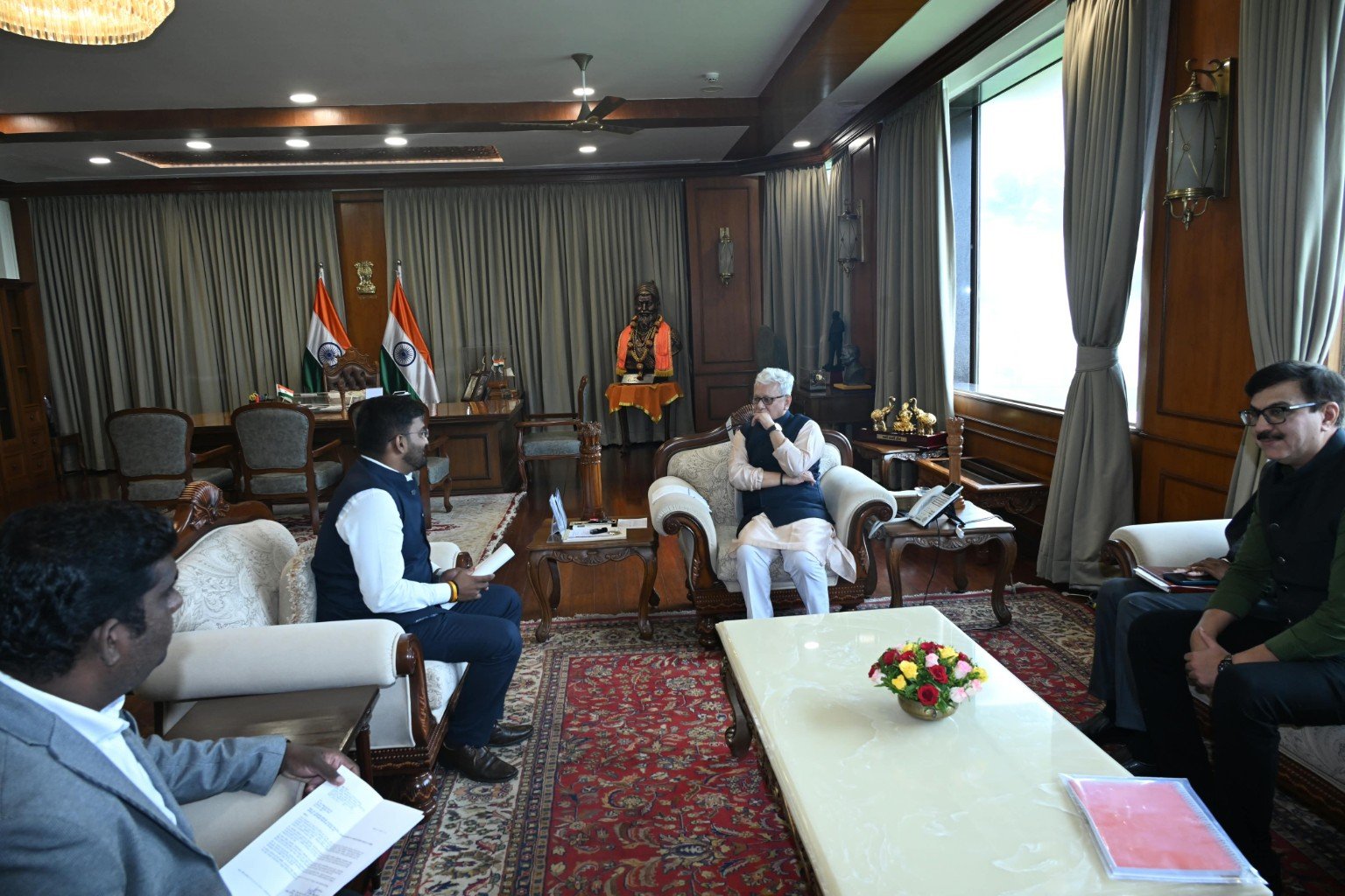 Institutional meeting photograph at the office of the Governor of Maharashtra